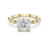 Round Cut Diamond Anniversary Ring With Pear Side Stone