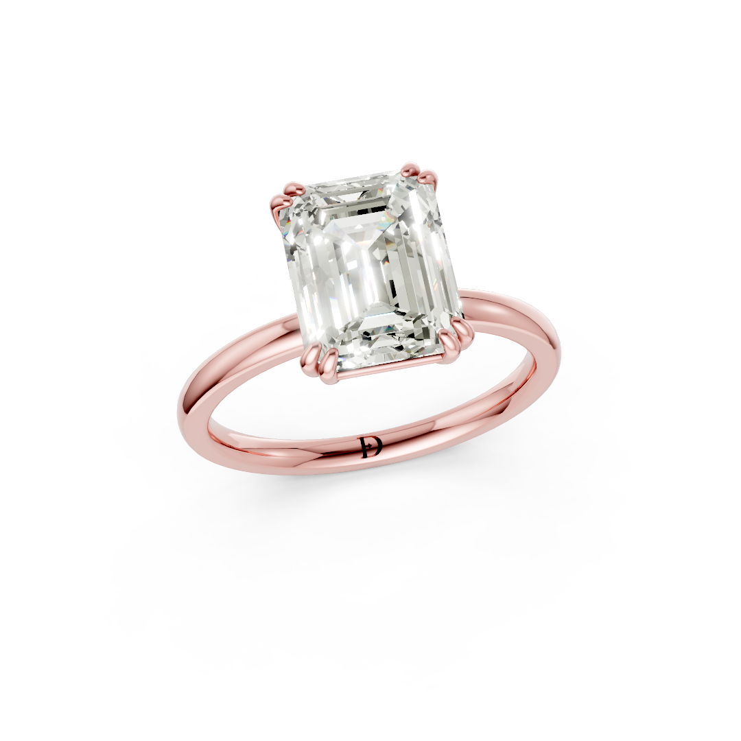 Double Prong Emerald Solitaire Ring