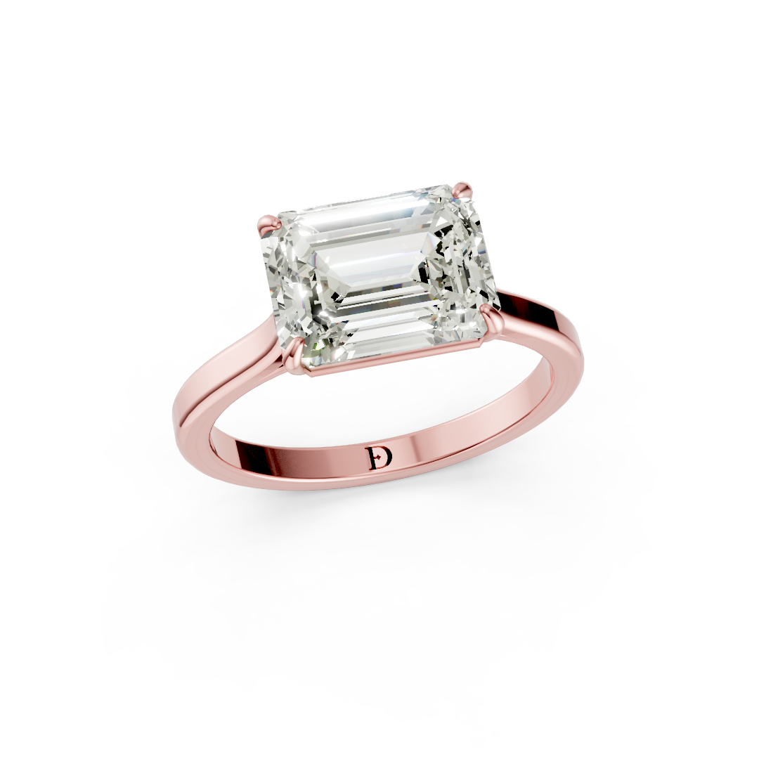 East West Emerald Solitaire Ring