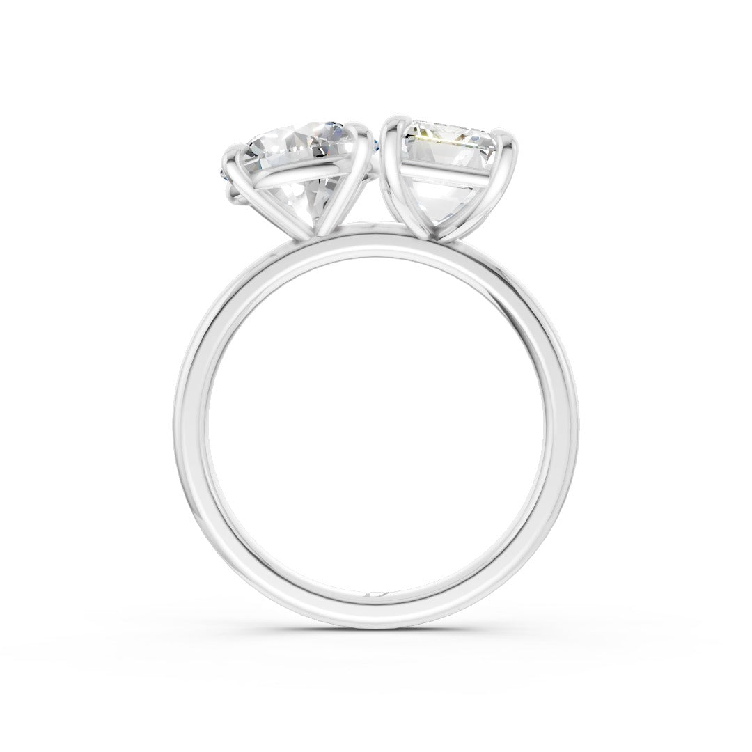 Emerald And Round Cut Diamond Two-Stone Ring