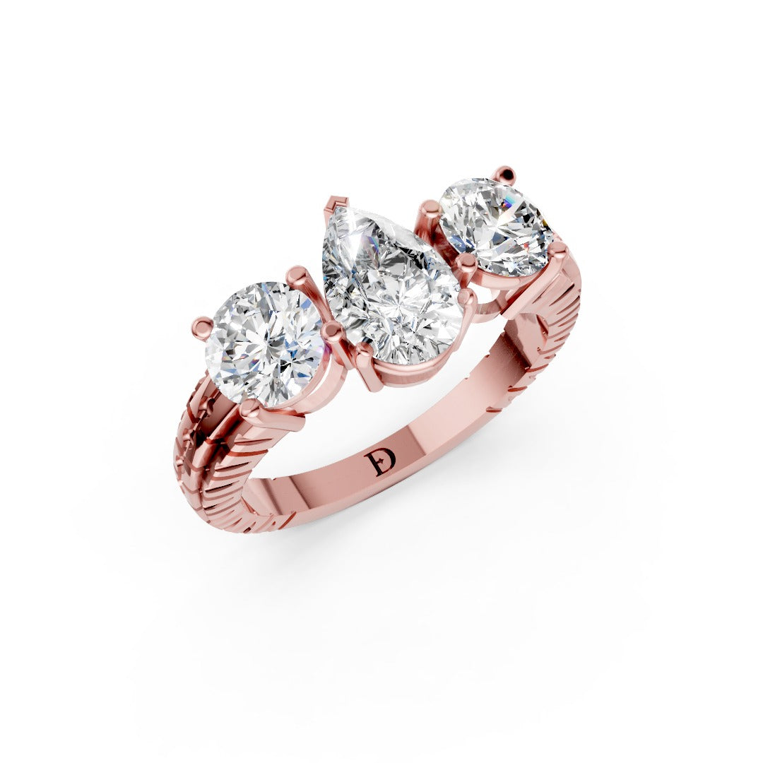 Pear Cut Three-Stone With Ribbed Textured Band Ring
