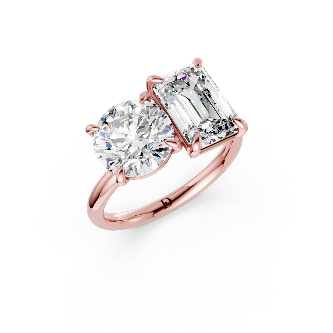 Emerald And Round Cut Diamond Two-Stone Ring