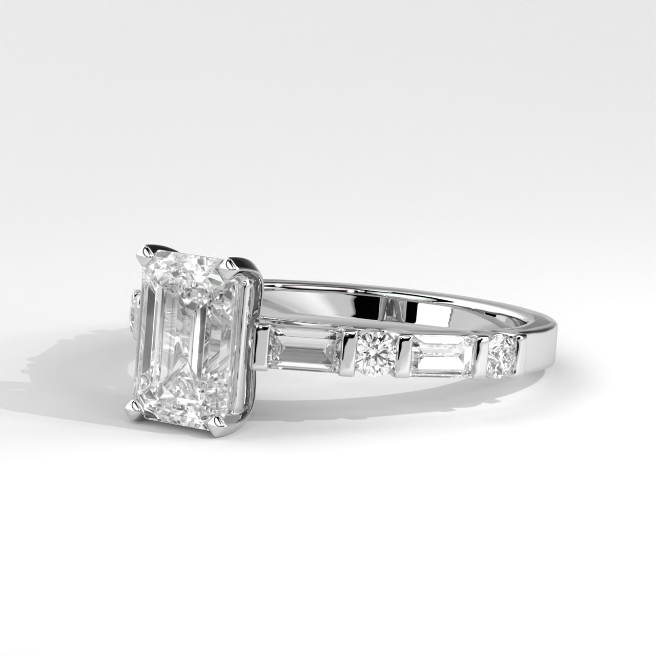 Emerald Cut Anniversary Ring With Alternating Baguette & Round Diamond Accents