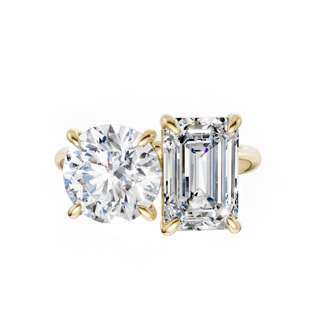 Emerald And Round Cut Diamond Two-Stone Ring