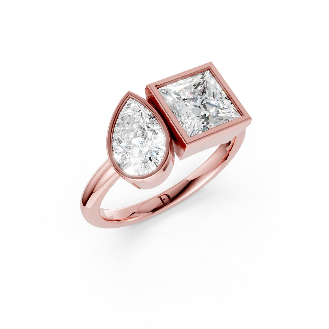 Toi at Moi Bezel Set Pear and Princess Cut Diamond Anniversary Ring