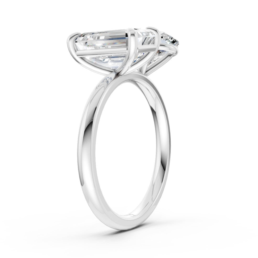 Emerald And Oval Cut Diamond Two-Stone Ring