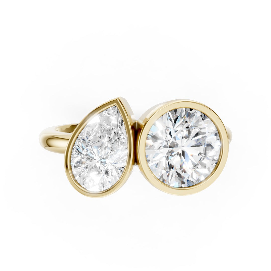 Toi at Moi Bezel Set Pear and Round Cut Diamond Anniversary Ring